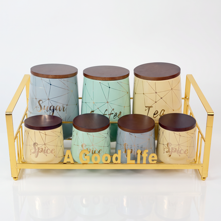 7-Piece Porcelain Seasoning & Storage Canister Set with Wooden Lids and Gold Metal Rack – "A Good Life"